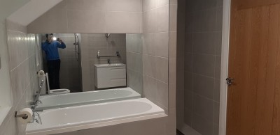 Bathroom installation in Cavan with whirlpool and marble effect tiling by North West Tiles & Timber, Ireland