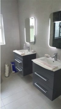 Double wall hung vanity units with new tiles and mirrors installed in a Ballinamore home by North West Tiles & Timber, Leitrim, Ireland
