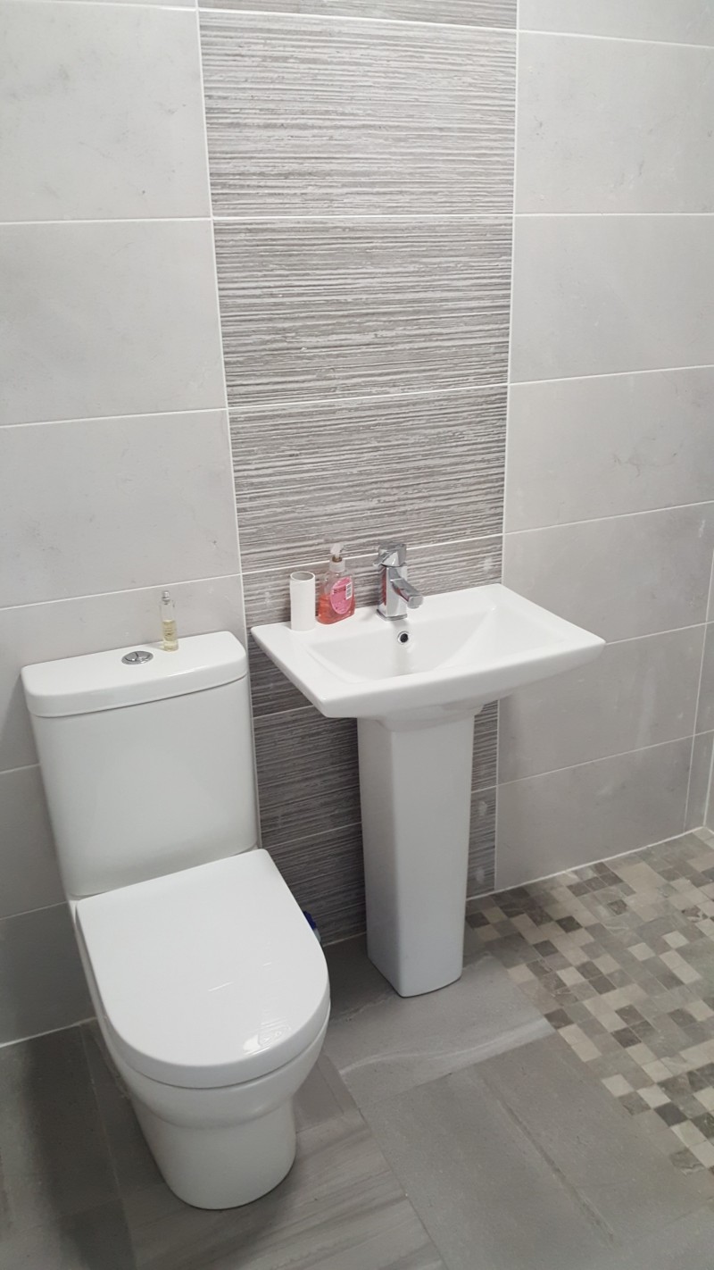 Toilet and basin in an en-suite wet-room  in Longford - design, supply and installation by  North West Tiles & Timber, Ireland